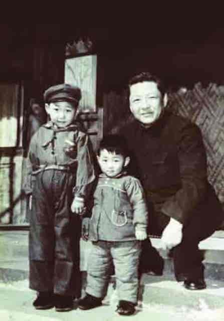 Xi Jinping (left) as a child with his father Xi Zhongxun (born 1913) and younger brother Xi Yuanping (born 1956).